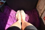 Keeping my feet warm in 36C degrees on a private car from Ella to Kataragama